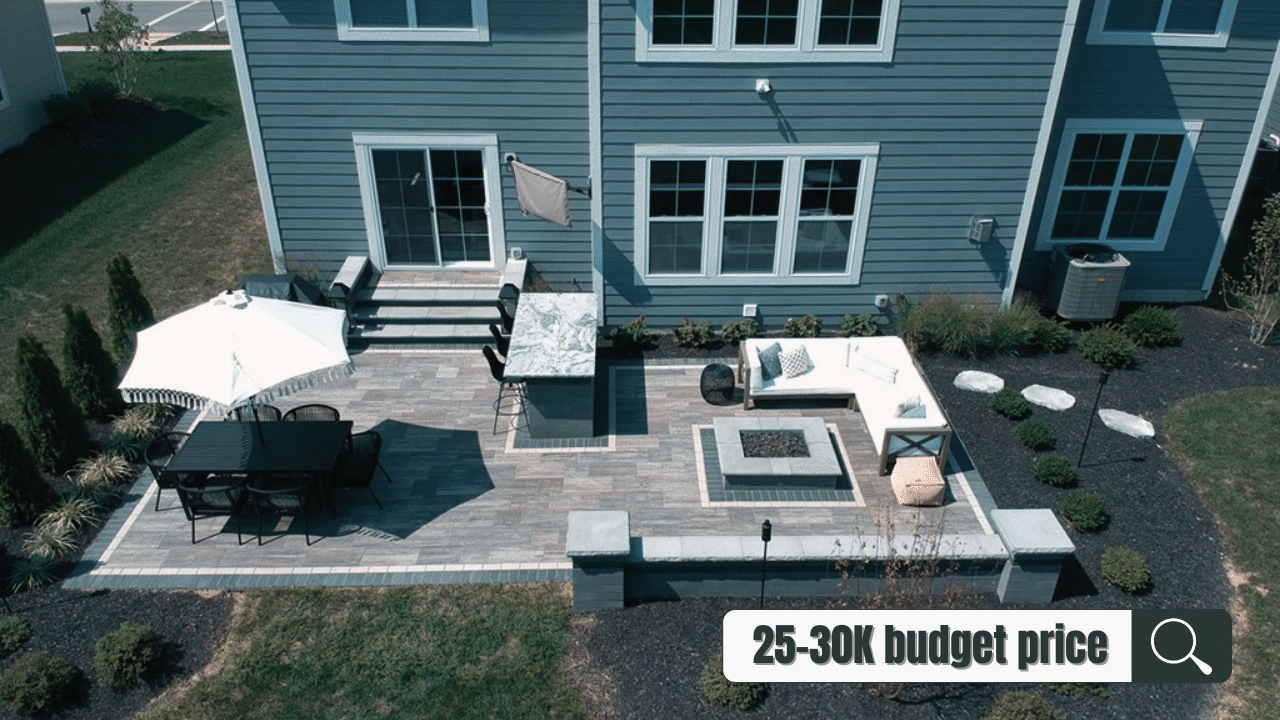 paver patio with seating area and quartz table in the 25,000 - 30,000 price range.